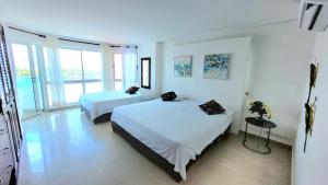 Postel nebo postele na pokoji v ubytování Torres del lago Pegasus Group Cartagena