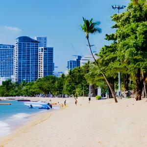a beach in the city with people playing in the water at THE BASE apartments at central pattaya in Pattaya