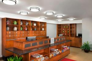 a waiting room with wooden cabinets and a cash register at Four Points by Sheraton Asheville Downtown in Asheville