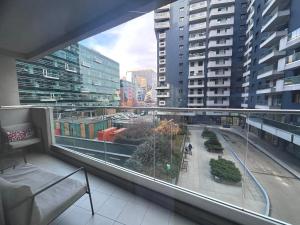 a balcony with a view of a city with buildings at 365 Apartments in Bucharest in Bucharest