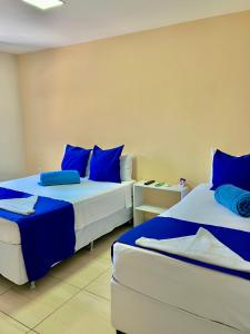 Cama ou camas em um quarto em Pousada Tropical Bessa