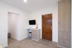 TV a/nebo společenská místnost v ubytování Apartamento Seashel
