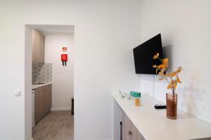 TV a/nebo společenská místnost v ubytování Apartamento Seashel