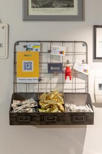 a suitcase on a shelf with signs on it at Miracolo al Duomo Smart Accomodations in Naples
