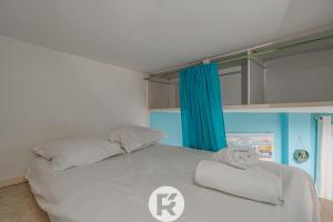 Tempat tidur dalam kamar di Le Petit Havre de Paix