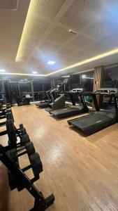 a gym with a row of treadmills and exercise machines at A BAHIA ACALMA in Salvador
