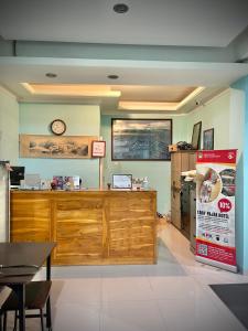 a fast food restaurant with a clock on the wall at Wesbobo inn Solo in Solo