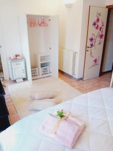a bedroom with a bed with a towel on it at B&B La Delice in Dalmine