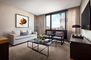 a living room with a couch and a table at Four Points by Sheraton Sydney, Central Park in Sydney