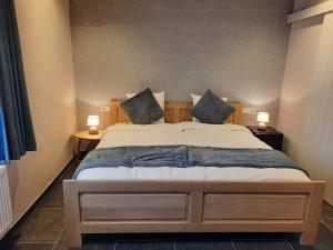 Postel nebo postele na pokoji v ubytování B&B Den Bruynen Bergh