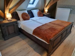 Postel nebo postele na pokoji v ubytování B&B Den Bruynen Bergh