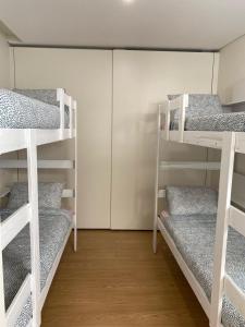 a room with four bunk beds in it at Casa Augusta 4 in Braga