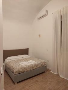 Ένα ή περισσότερα κρεβάτια σε δωμάτιο στο Residence e appartamenti Bausan
