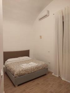 Residence e appartamenti Bausan tesisinde bir odada yatak veya yataklar