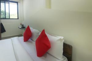 Katil atau katil-katil dalam bilik di Hotel Felicita Airport Inn