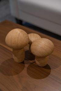 two mushrooms sitting on top of a wooden table at Broom Cottage in Lanark
