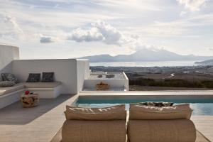 a villa with a swimming pool with a view at Villa Manikas Milos in Adamas