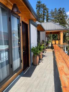 a porch of a house with a wooden deck at Mây Núi Homestay in Sapa