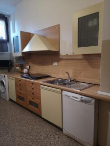 a kitchen with a sink and a stove at Loreto Elite Milano in Milan