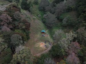 an aerial view of a house in the middle of a forest at Chalet Amauleza in San Gerardo de Dota