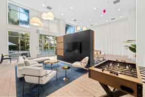 a living room with a large pool table at Pineapple Haven in San Diego