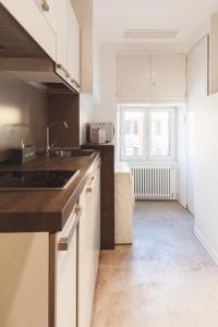 Kuchyň nebo kuchyňský kout v ubytování The Place Giuliana + 25 fotografií