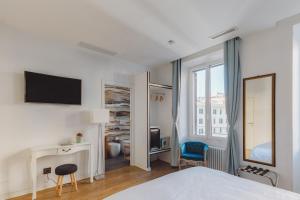 TV a/nebo společenská místnost v ubytování The Place Giuliana