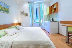 Ένα ή περισσότερα κρεβάτια σε δωμάτιο στο Studio Apartments Stradun