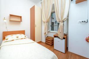 Ένα ή περισσότερα κρεβάτια σε δωμάτιο στο Studio Apartments Stradun