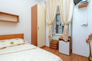 Ένα ή περισσότερα κρεβάτια σε δωμάτιο στο Studio Apartments Stradun