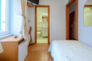 Ένα ή περισσότερα κρεβάτια σε δωμάτιο στο Studio Apartments Stradun