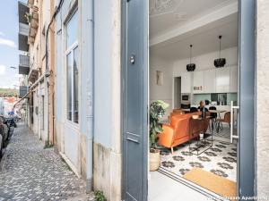 an open door to a living room and dining room at Akicity Campolide Light in Lisbon