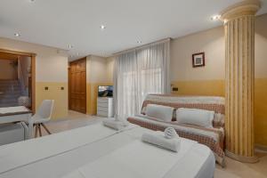 a living room with a bed and a couch at Villa Soler House in Malaga by Costarentals - MAL03 in Málaga