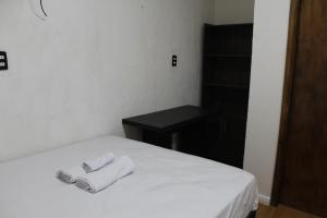 Ένα ή περισσότερα κρεβάτια σε δωμάτιο στο AP 411- Apart OH