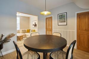 a dining room with a table and chairs at Host & Stay - Penny Farthing Cottage in Whitby