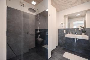 a bathroom with a shower and a sink at Purer Genuss - Garten und Alpe in Owingen +33 photos