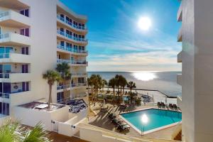 an aerial view of a hotel with a swimming pool and the ocean at East Pass Towers 302 in Destin