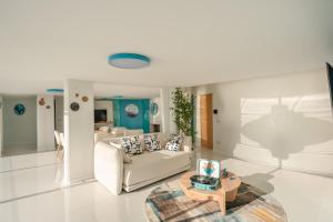 a living room with a couch and a table at Laguna Blu in Vietri sul Mare +44 photos