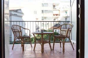 a table and two chairs sitting on a balcony at Affittacamere Le Dimore del Riccio in Foggia