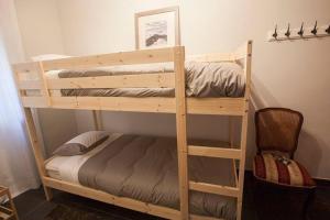 a couple of bunk beds in a room at XALET CARLEMANY (Casa entera /hab.) in Erts
