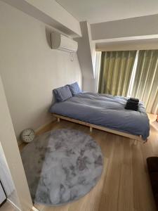 Ένα ή περισσότερα κρεβάτια σε δωμάτιο στο Kabukichō Guest House