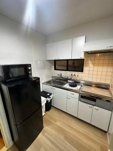 Η κουζίνα ή μικρή κουζίνα στο Kabukichō Guest House