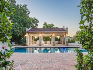 a house with a swimming pool in a yard at Monkey Thorn Lodge & Wellness Spa - Adults Only in White River