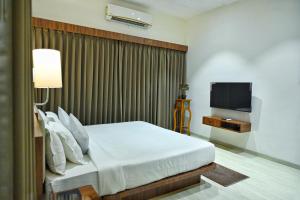 TV a/nebo společenská místnost v ubytování The One Hotel Nashik