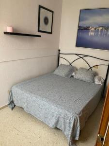 a bedroom with a bed and a tv on the wall at Room Sol Vecindario Gran Canaria Free parking in Vecindario