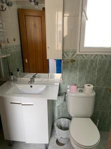 a bathroom with a white toilet and a sink at Room Sol Vecindario Gran Canaria Free parking in Vecindario