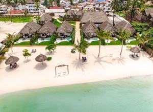 an aerial view of a resort on the beach at Safaya Luxury Villas - Adults only in Nungwi