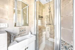 a bathroom with a sink and a shower at Studio Mac Mahon - Champs Elysees in Paris +16 photos