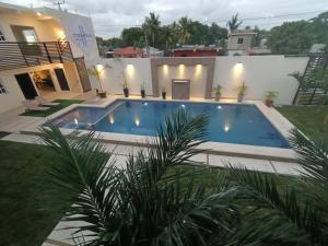 a swimming pool in the backyard of a house at OTOCH HE'ELEL in Huay Pix