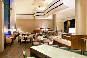 a dining room with tables and chairs at The Westin Waltham Boston in Waltham